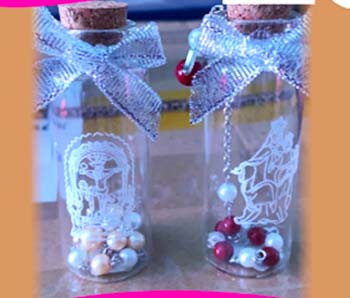 BOTELLA CON PULSERA SANTOS