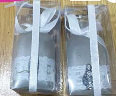 BOTELLA EMPABONADA CON DIJE Y CAJA MICA